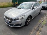 a silver car parked on the side of the road