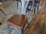 tables and chairs in a restaurant with a price tag on the back