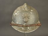 a helmet on a stand with a rope around it
