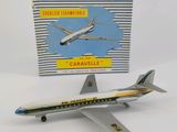 a toy airplane that is sitting next to a box of cigarettes