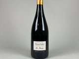 a bottle of champagne sitting on top of a white table