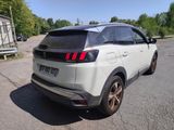 the rear end of a white suv parked in a parking lot