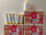 three boxes of skin care products are stacked on top of each other