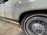 a car that is parked in a garage with the door open