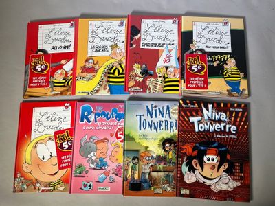 plusieurs livres pour enfants sont alignés sur une surface blanche