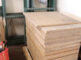 a pile of cardboard sitting on a pallet in a room