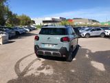 the car is parked in the parking lot near many other cars