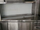 a stainless steel kitchen with a sink and a dishwasher