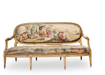 a couch that has a tapestry on it with people on it