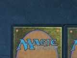 two decks of magic the gathering are shown on a blue background