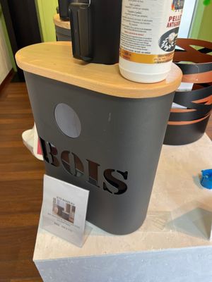 a cup of coffee on top of a coffee maker