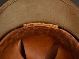 a close up of a brown hat with a brown brimle