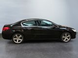 a picture of a black car that is parked in a garage