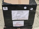 a black box with a cardboard on it sitting on a pallet