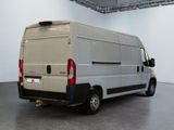 a white van that is parked in a room
