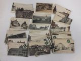 several old black and white photographs of a farm and buildings