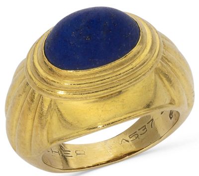an image of a gold ring with a lapis stone in the center