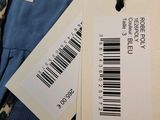 two tags on a blue shirt with a barcode on it