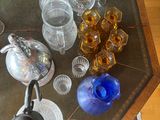 a glass table with a lot of glasses on it