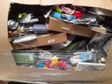 a cardboard box full of assorted items in it