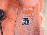 a sticker on the side of an orange brick wall