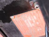 a close up of a metal object on a red surface