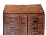 an image of a wooden chest of drawers with brass hardware