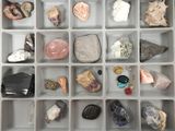 many different types of rocks and stones in this box