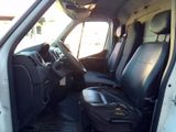 a white van with black leather seats in the back of it