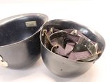 two black pots that are sitting next to each other