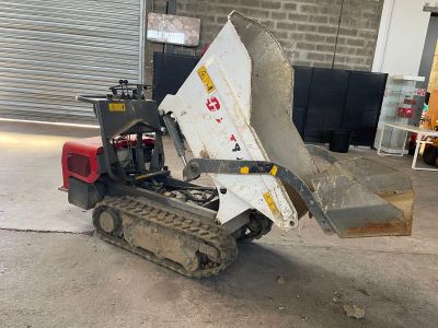 a small machine that is parked in a garage