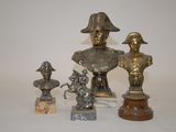 a lot of statues that are sitting on a table
