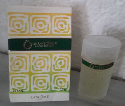 an image of a bottle of lotion next to a box of lotion