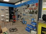 a store with a lot of electronics on the shelves
