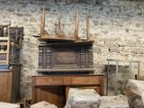 several pieces of furniture are stacked on top of each other in a room