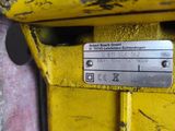 a close up of a metal plate on the side of a yellow truck