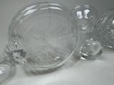 a lot of glass pieces that are sitting on a table