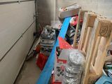 a room with a lot of tools and other items on the floor