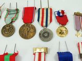 many medals and medals on display on the wall