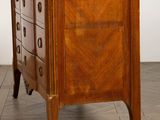 an image of a wooden chest of drawers with a marble top