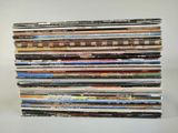 a lot of cds stacked on top of each other
