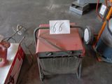 a cart with a number 66 on it in a garage