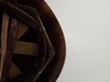 a close up of a helmet on a white surface
