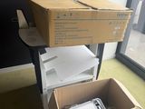 a carton full of boxes and papers sitting on the floor