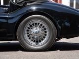 an image of a black sports car parked in a parking lot