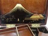 a wooden box with a picture of a mountain in it