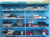 a blue cabinet with many different items on it