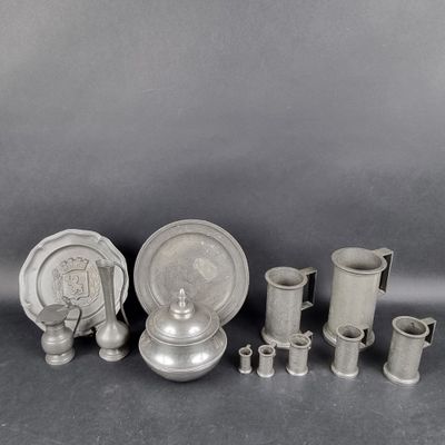 a group of silverware including a teapot, cups and saucer
