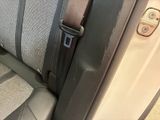 a seat belt that is attached to the back of a car