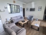 an image of a living room with couches and a coffee table